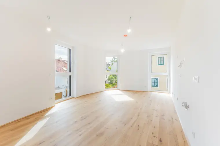 2-Zimmer-Erstbezug mit Loggia &amp; besonderem Flair