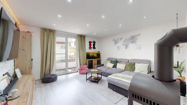 Wohnglück mit Ofenwärme &amp; Sonnenbalkon - Modernisierte 3-Zimmer-Balkonwohnung in Saalfelden