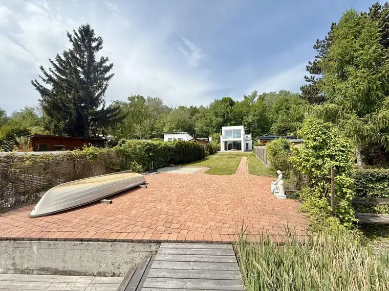 NEUWERTIGES Haus am Pöttschinger See - Direkter Seezugang - BJ 2022 - ca. 574m² Pachtgrund - ca. 198m² NFL - 4 Zimmer - 2 Bäder - Balkon und Terrasse - neuwertige Einbauküche - große Doppelgarage