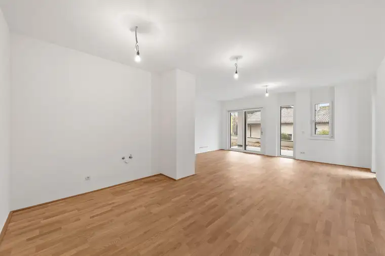 Moderner Erstbezug: Sonnige 4-Zimmer-Wohnung mit Terrasse und Garten