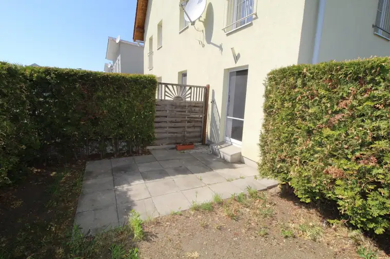GARTENWOHNUNG in SCHNELLBAHNNÄHE mit Fußbodenheizung, Parkplatz und großem Kellerabteil