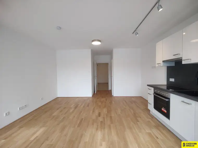 Neubau Eigentumswohnung mit Balkon und Tiefgaragenplatz