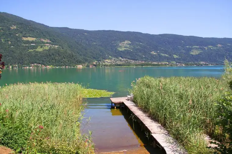 EXKLUSIVES SEEGRUNDSTÜCK MIT DIREKTEM ZUGANG ZUM OSSIACHER SEE – FERIENWOHNSITZ IN BESTLAGE