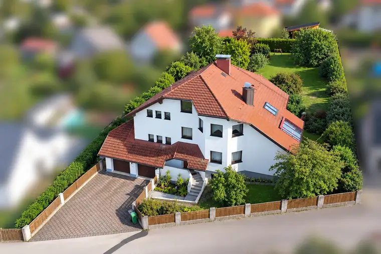 Großzügig wohnen auf über 1.400 m² Grund: Gepflegtes Ziegelmassivhaus mit Wintergarten+Doppelgarage