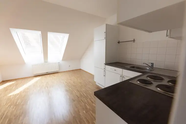 Wunderschöne Dachgeschosswohnung mit Ausblick auf den Schlossberg in zentraler Lage zu verkaufen