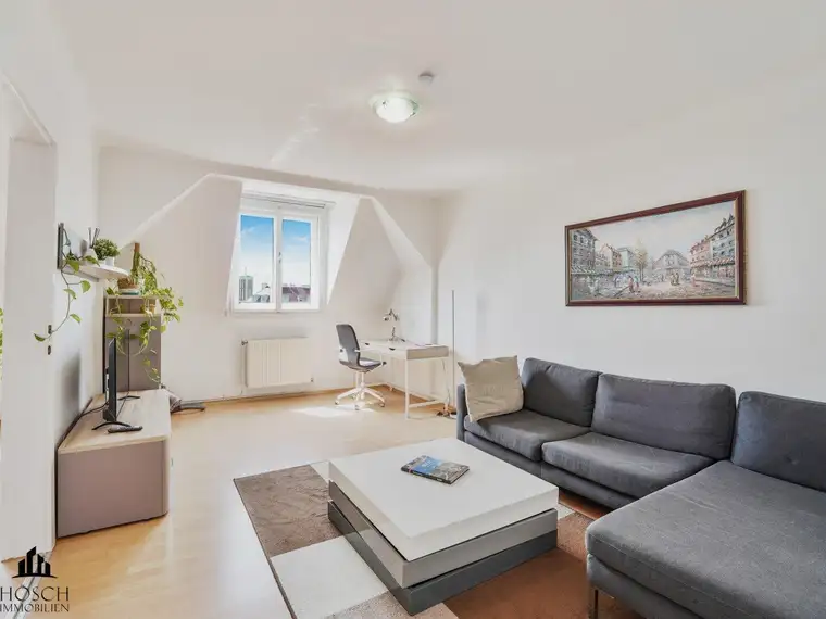 Dachgeschosswohnung mit 3-Zimmer-Potenzial in gepflegtem Altbau