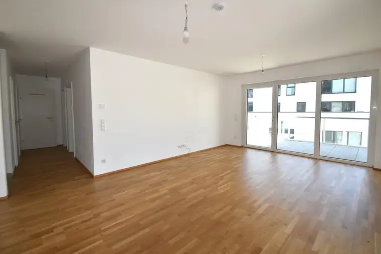 Exklusive Neubauwohnung mit Balkon und Tiefgaragenstellplatz in ruhiger Stadtnähe