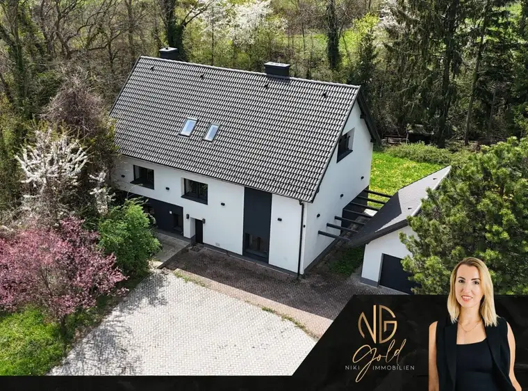 Großzügiges Familienhaus mit parkähnlichem Grundstück und Bachlage