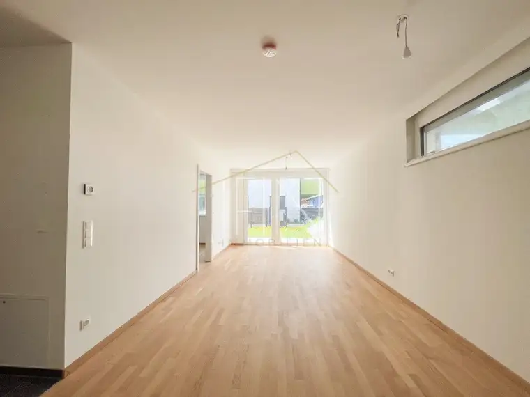 Erstbezug! 2-Zimmer Gartenwohnung mit Garagenplatz und Gemeinschaftsdachterrasse