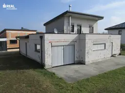 Modernes Einfamilienhaus mit Garage, Garten und großzügigem Nebengebäude