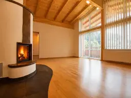 Dachgeschosswohnung mit Sichtdachstuhl, Kaminofen und großem Balkon in Fieberbrunn