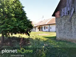 Solides Gebäude in Steinbauweise, viel Stellfläche, großer Garten mit Baumbestand