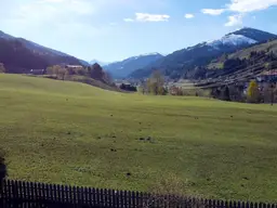 Baugrund auf der Sonnseite mit Blick auf die Hohen Tauern und das Kitzbüheler Horn