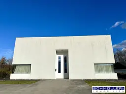 Modern minimalistisches Büro/Galerie Gebäude im Grünen mit Parkplätzen
