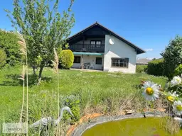 Bungalow: gepflegtes Wohnhaus mit grünem Garten in ruhiger Lage