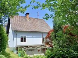 PERFEKTES FAMILIENDOMIZIL mit GROSSEM GARTEN und BAULANDreserve