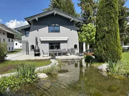 Charmantes Einfamilienhaus mit Garten &amp; Teich – Kössen | Eingetragenes Wohnrecht im Preis berücksichtigt