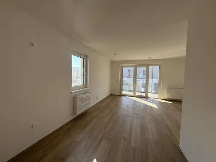 Haus_1_Top_5_Küche_mit_Blick_auf_Wohnbereich