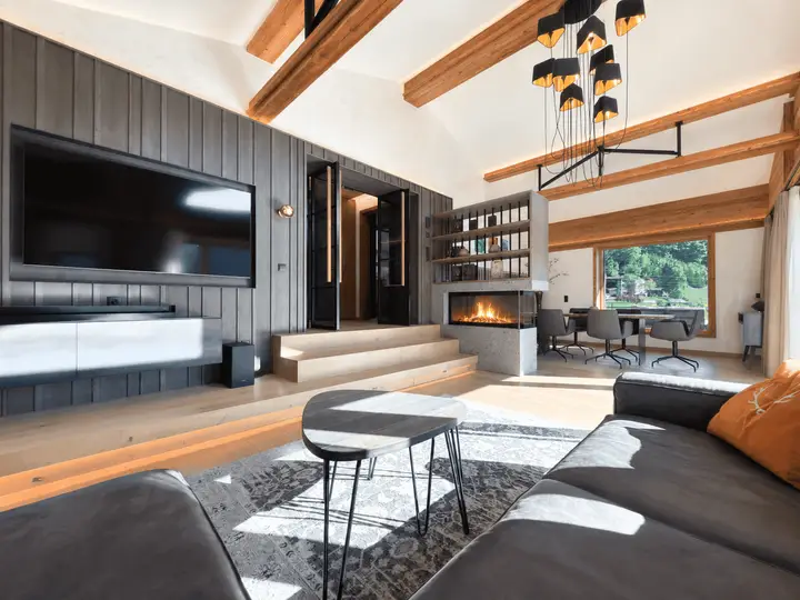 Sunlit Alpine Living Room with Fireplace