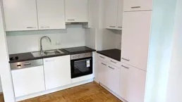 Erstbezug: Ruhiger 2 ZIMMER-NEUBAU + große Terrasse 12m² + neue Einbauküche + neue Sanitäranlagen!