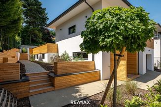 ERSTBEZUG! Modernes, stylisches Einfamilienhaus mit großer Terrasse, Einliegerwohnung, Garage - Wellnessbereich und hübschem kleinen Garten