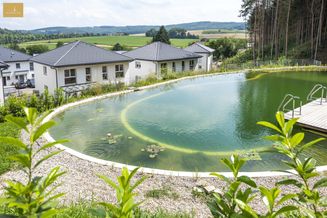 Familienfreundliche Doppelhaushälfte mit Biopool und Eigenwald