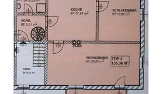 Grundriss des Erdgeschosses mit Wohnzimmer, Küche, Schlafzimmer und Balkon.