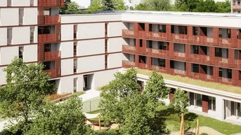 Modernes Wohngebäude mit roten Fassadenelementen und einem grünen Innenhof mit Spielplatz.