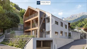 Modernes Mehrfamilienhaus in alpiner Umgebung mit Bergblick und Tiefgaragenzufahrt.