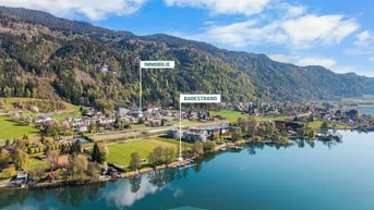 Luftaufnahme des Sees mit umliegender Landschaft, Bergen und markierten Immobilienstandorten.