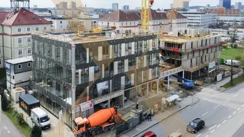 Expose Einzigartige Neubau Geschäfts-/Gastrofläche im Neubauprojekt "Med Cube Linz Mitte" zu vermieten!