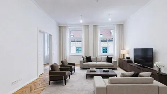Helles Wohnzimmer mit Fischgrätparkett, modernen Möbeln und Blick auf die Stadt.