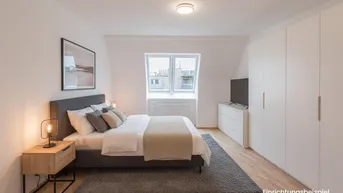 Helles Schlafzimmer mit Holzboden, großem Kleiderschrank und gemütlichem Bett unter einem Dachfenster.