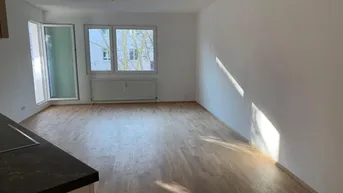Expose Frisch saniert, zentral und ruhig: Neubauwohnung mit großer Wohnküche und Logia