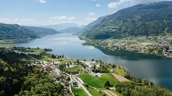 Expose Exklusives Baugrundstück mit Seeblick und Freizeitwohnsitzwidmung – Rarität am Ossiacher See