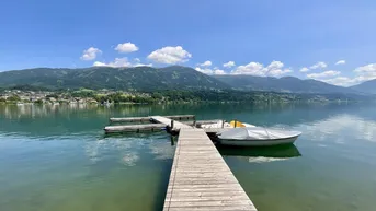 Expose WOHNEN AM WASSER - BEGEHRT WIE NIE! EIGENTUMSWOHNUNG MIT EIGENEM SEEGRUNDSTÜCK (DIREKTER, PRIVATER SEEZUGANG) SOWIE BOOTSANLEGEPLATZ IN GIGANTISCHER NATURLAGE AM MILLSTÄTTER SEE