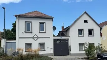 Expose Traumhaftes Mehrfamilienhaus-Ensemble: 3 Wohneinheiten, XL-Garten, 2 Garagen!