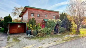 Expose Wohnen am See - Charmantes Holzhaus bei Wohnsiedlung mit Badesee