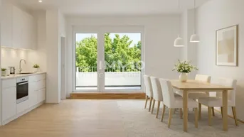 Heller offener Wohn- und Essbereich mit moderner Küche und Zugang zum Balkon.