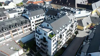 Expose Karmeliterhof - Neubauwohntraum beim Rathausplatz