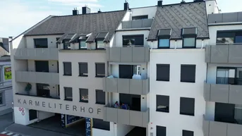 Expose Karmeliterhof - Neubauwohntraum beim Rathausplatz
