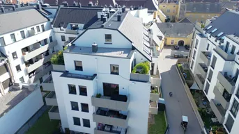 Expose Karmeliterhof - Neubauwohntraum beim Rathausplatz