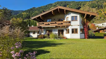 Expose Seltenes Juwel: Gepflegtes Einfamilienaus direkt am Golfplatz mit Kitzsteinhornblick