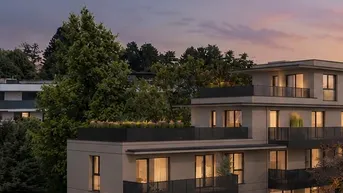 Moderne Architektur eines Mehrfamilienhauses mit großzügigen Balkonen und Dachterrassen in grüner Umgebung.