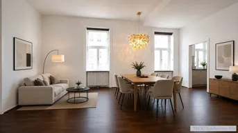 Heller, offener Wohn- und Essbereich mit hohen Decken, großen Fenstern und dunklem Parkettboden.
