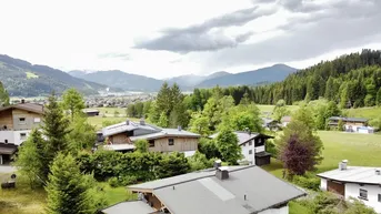 Expose Sonnenlage mit Kaiser-Panorama – Traumgrundstück mit genehmigtem Bauprojekt