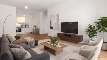 Moderner offener Wohnbereich mit bequemer Sitzecke, Holzboden und integrierter Küche im Hintergrund.