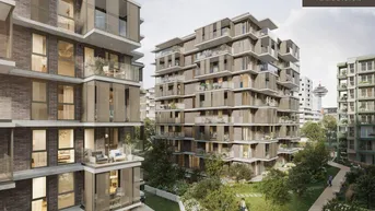 Moderne Wohngebäude mit Balkonen und einem weiten Blick auf die Stadt und einen Turm.