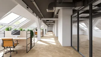 Modernes Großraumbüro im Dachgeschoss mit vielen Dachfenstern, industrieller Decke und ergonomischen Arbeitsplätzen.