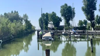 Expose Traumhaftes Baugrundstück mit direktem Seezugang in Neusiedl am See im Refugium